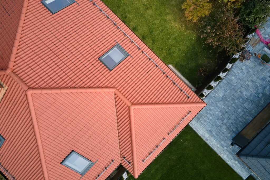 closeup-of-attic-windows-on-house-roof-top-covered-2023-04-20-02-52-00-utc (1)