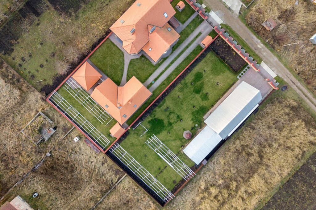 top-down-aerial-view-of-a-private-house-with-red-t-2023-02-08-01-13-29-utc (1)